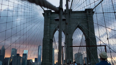 Brooklyn Bridge at beautiful sunset on summer evening with Manhattan skyline in NYC