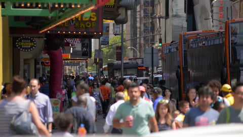 foot traffic in Times Square, crowded street with people walking in busy Manhattan in NYC